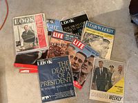 Photo showing 9 vintage magazines from the 1960s related to JFK, civil rights, and space race.