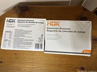 Box front and back of HDX Sawhorse Brackets showing product name and details