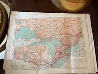 Map showing southern Ontario and Great Lakes region with railway lines, sailing routes, and telegraph lines, in a vintage muted color palette.