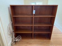 Front view showing two compartments with adjustable shelves inside.