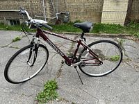 Side view of the full Mongoose Hybrid Velocity bicycle showing the frame, tires, seat, pedals, and drive components.