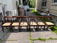 Six chairs in single row showing overall set