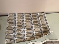 Front side of uncut sheet showing portrait and serial numbers