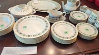Complete Royal Doulton Tapestry dinnerware displayed: large and small plates, serving pieces including teapot, creamer, covered casserole dish, multiple cups and saucers.