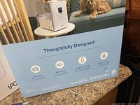 Blue box with Levoit branding and features of humidifier listed.