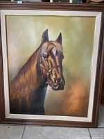 Frontal view of the framed realistic horse painting, showing the horse head with detailed features and a bridle.