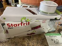 Starfrit Pro Mandoline slicer on its original box placed on kitchen counter