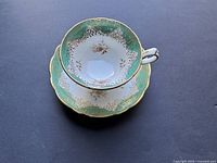 Cup and saucer set with viewed from above showing full decorative pattern inside bowl of cup and saucer design