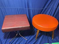 Pair of mid-century footstools: one square brown leatherette with chrome base, one round orange vinyl on wooden legs with brass caps.