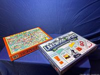 Photo showing the unopened Lakewood-Opoly board game box and Denver map puzzle box.