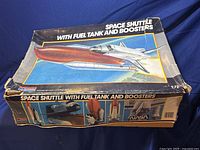 Box showing the kit title 'Space Shuttle with Fuel Tank and Boosters' and colorful illustration of the shuttle in flight with fuel tank and boosters.