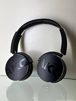 Front view of AKG C50 wireless Bluetooth headphones showing large AKG logos on ear cups.