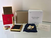 Overview of all five items with original packaging and drawstring pouch