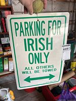 Front view of the novelty sign showing text 'PARKING FOR IRISH ONLY ALL OTHERS WILL BE TOWED' with green arrows left and right.