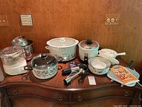 Overview of all items arranged on wooden surface against plywood background