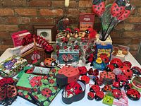 Wide front view of entire lot arranged on table against brick wall