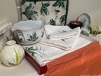 Overall view of linens and decorative items arranged on table