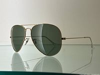 Sunglasses angled side view showing frame profile and lens tint