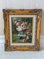 Full view of framed oil painting leaning against wall