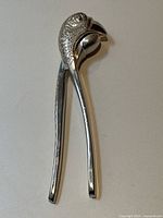 Top-down view of closed nutcracker on white background showing full length and overall shape.