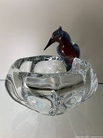 Front view of bowl and bird figurine