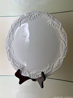 Top view of platter with raised lily of the valley border on display stand