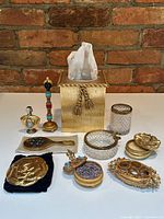 Group shot of entire lot on tabletop against brick background