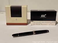 Pen and two ink boxes on white background