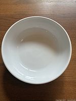 Top view of white ceramic serving bowl showing smooth interior and round shape