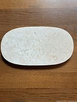Top view of the marble cheese board showing natural stone surface and veining details.
