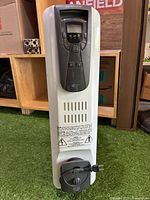 Front view of Kenwood electric space heater showing digital control panel and built-in handle.