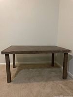 Front view of the driftwood low table showing four solid legs and rectangular top
