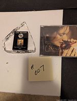 Photo of the Celine Dion diamond award plaque and Celine Dion CD album "These Are Special Times" with cover art.