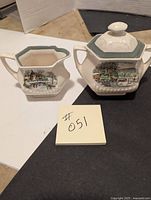 Hexagonal cream and sugar set with old winter scene design and green trim