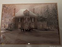 Close-up of the framed print showing the winter house scene with horse and people in the snow.