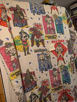 Showcase of the comforter laid out with visible illustrations of multiple WWF wrestlers for pattern and design.