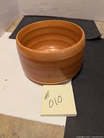 Top-down view of medium brown wooden bowl showing round shape and smooth interior.