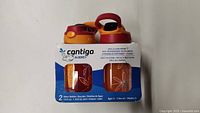 Front view of two sets of Contigo Aubrey kids water bottles showing packaging and bottle designs.