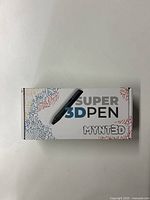 Front of Super 3D Pen MYNT3D box showing branding and stylized graphics.