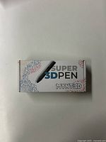 Front of box showing Super 3D Pen branding and packaging design.