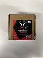 Front of the brown cardboard box showing Bullfix logo, product name, quantity 24 fixings, and usage claim for plasterboard.