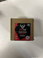 Front view of BULLFIX box showing brand, model 'Holds Strong', 24x universal fixings for drywall up to 20kg.