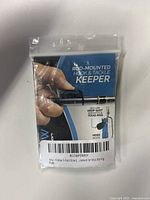 Front package view of a 5-pack of FinMan rod-mounted hook and tackle keepers with label and product information visible