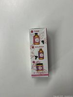 Box side showing skincare steps: tone, nourish, and lift with images of product bottles and jars.