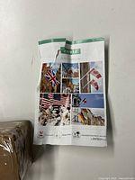 Photo of promotional brochure or product catalog with flag images, providing aesthetic context and potential product applications.