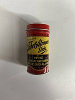 Front of the metal canister showing product name and purpose to remove furniture and flooring scratches.