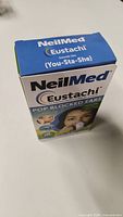 Front and angle view of the sealed NeilMed Eustachi box showing branding and product purpose for popping blocked ears.