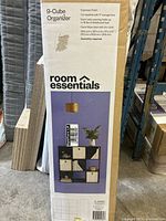 Photo of product box showing front with product image and features.