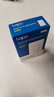 Front view of original Tapo S505 Smart Wi-Fi Light Switch packaging, showing product name and image.