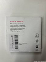 Back side of one retail box showing branding details, product claims including cruelty-free, vegan, and made from recycled materials.